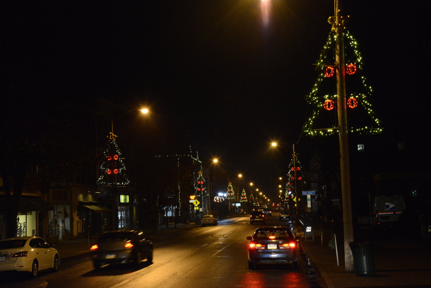 For years and years, these trees have lit the way of Main Street motorists and pedestrians through chilly winter nights.
